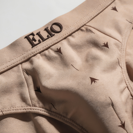 ELIO Tan brief waistband detail, arrow motif print, ELIO logo branding
